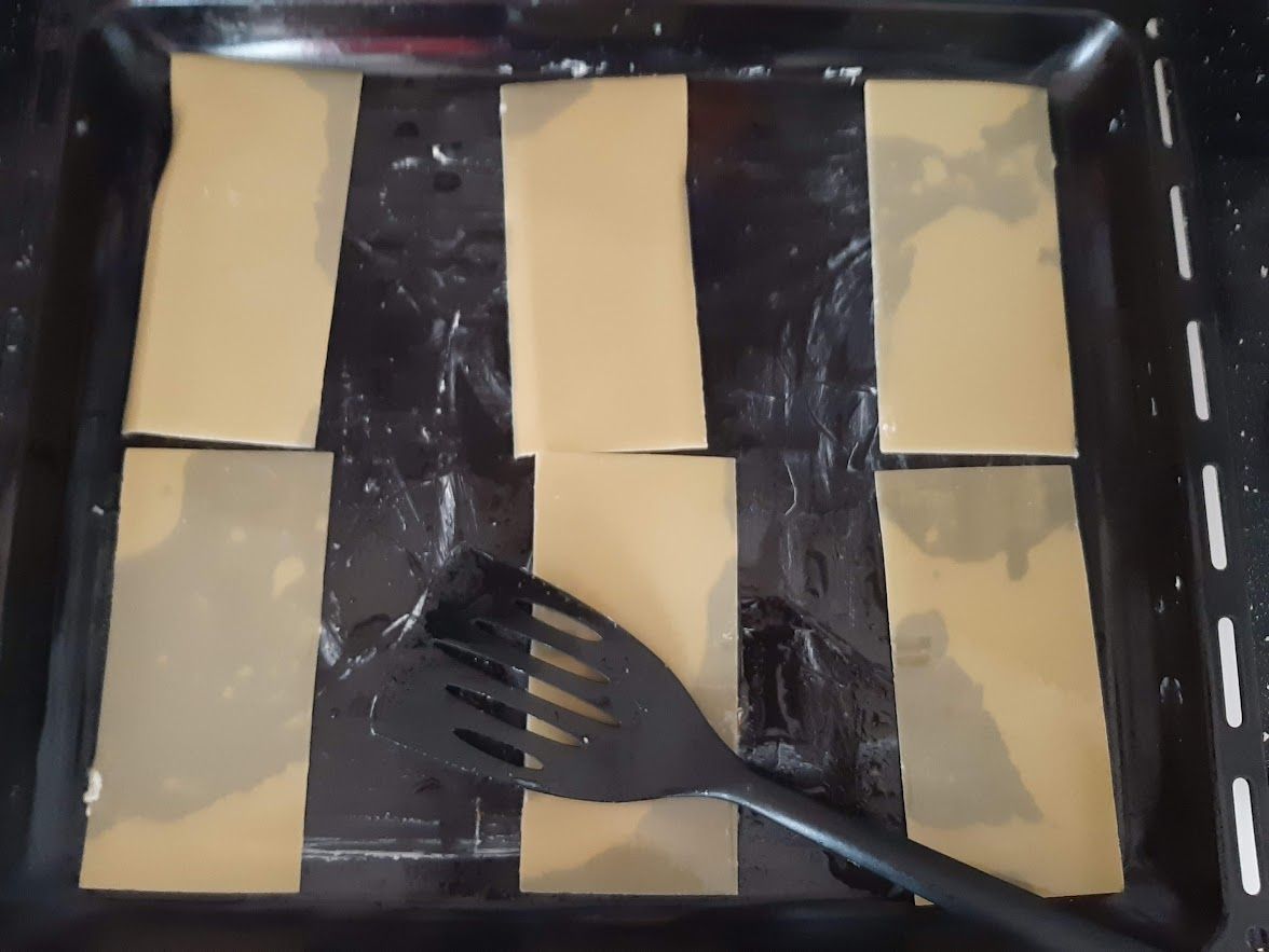 lasagna crusts into a baking tray