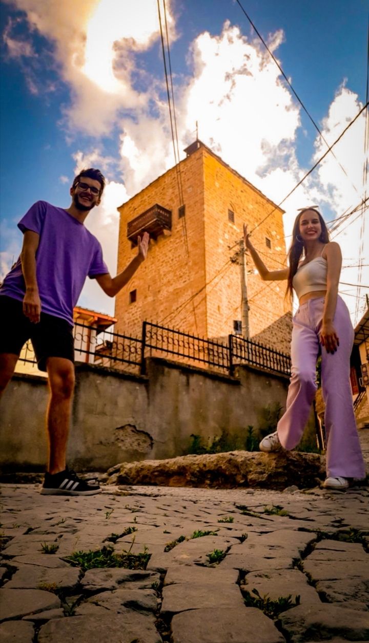 two people pretending to be holding a tower in Kratovo